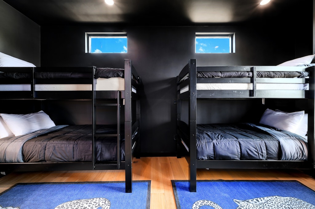 7809 Woodrow Avenue Austin, TX 78757 - Photo 27 of 40 a living room with furniture and a flat screen tv