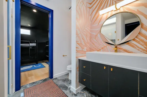 a bathroom with a sink and mirror