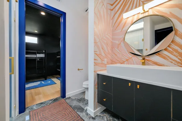 a bathroom with a sink and mirror