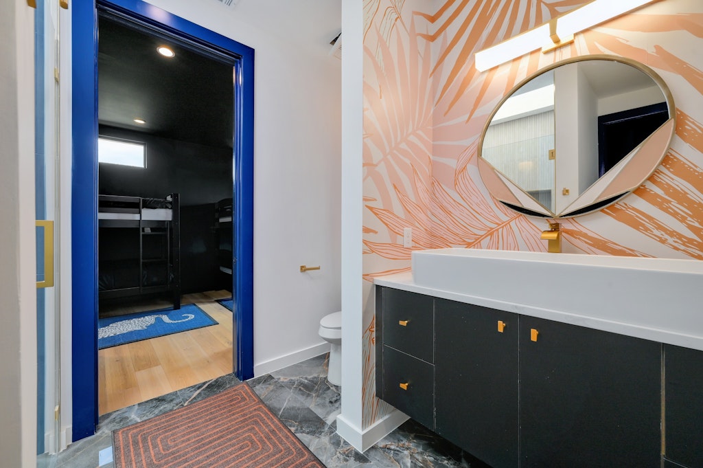 7809 Woodrow Avenue Austin, TX 78757 - Photo 28 of 40 a bathroom with a sink and a mirror