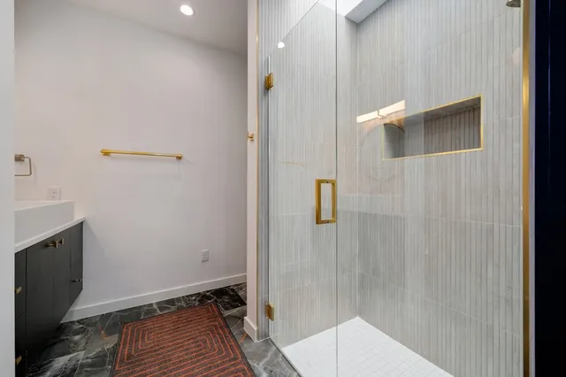 a view of a backyard with plants and a patio