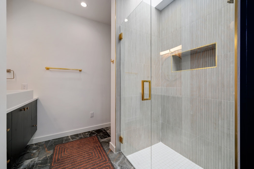7809 Woodrow Avenue Austin, TX 78757 - Photo 30 of 40 a bathroom with a sink and mirror