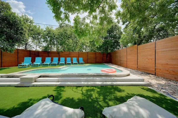 a view of a backyard of a house