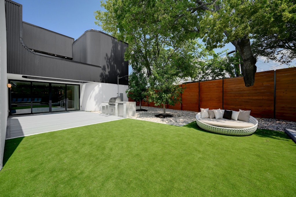 7809 Woodrow Avenue Austin, TX 78757 - Photo 34 of 40 a view of a backyard with furniture and a fire pit