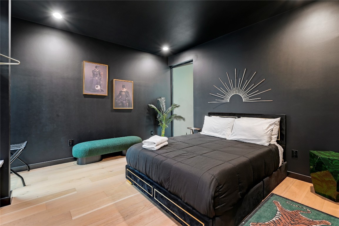 7809 Woodrow Avenue Austin, TX 78757 - Photo 40 of 40 a bedroom with a bed and a chandelier