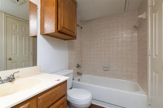 a bathroom with a sink a toilet and a bathtub