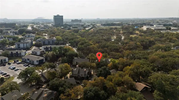 an aerial view of city and trees
