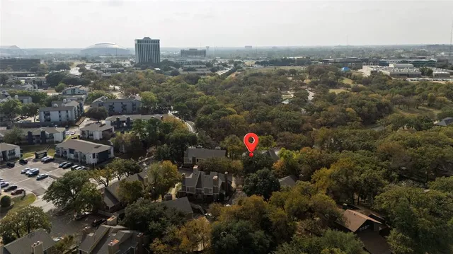 an aerial view of city and trees