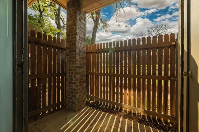 a view of a balcony with wooden floor