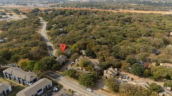 an aerial view of residential houses with outdoor space
