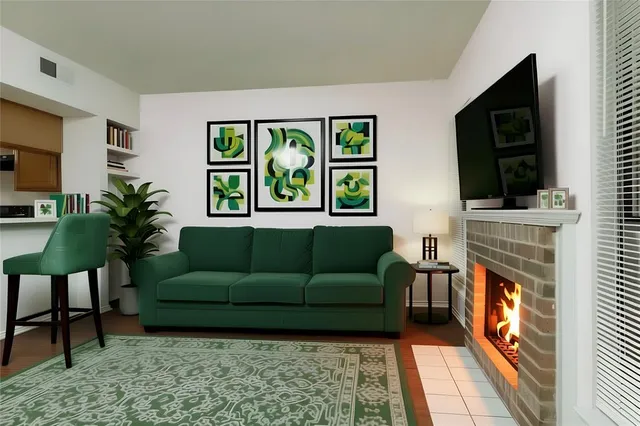 a living room with furniture a flat screen tv and a fireplace