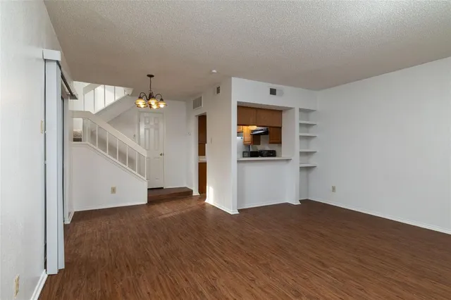 a view of a kitchen with wooden floor