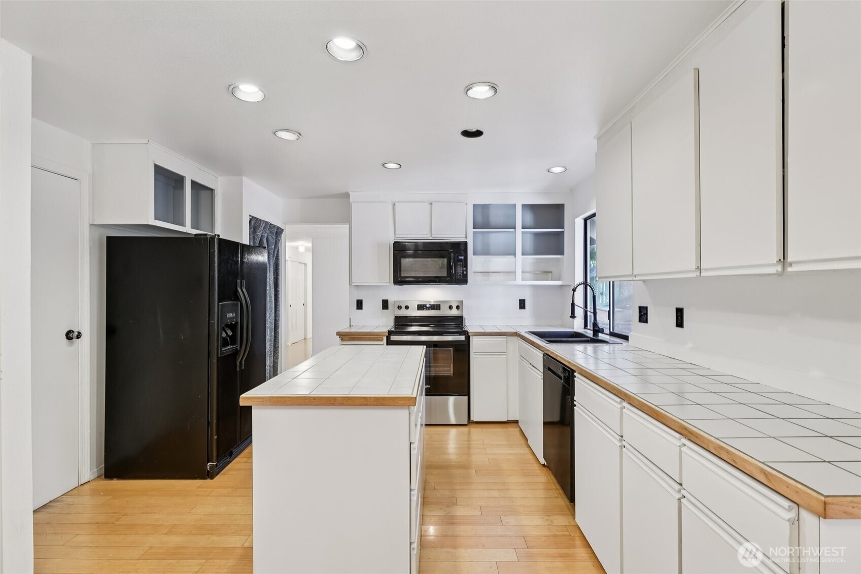 32229 2nd Avenue Southwest Federal Way, WA 98023 - Photo 11 of 40 a kitchen with stainless steel appliances granite countertop a refrigerator stove microwave and sink