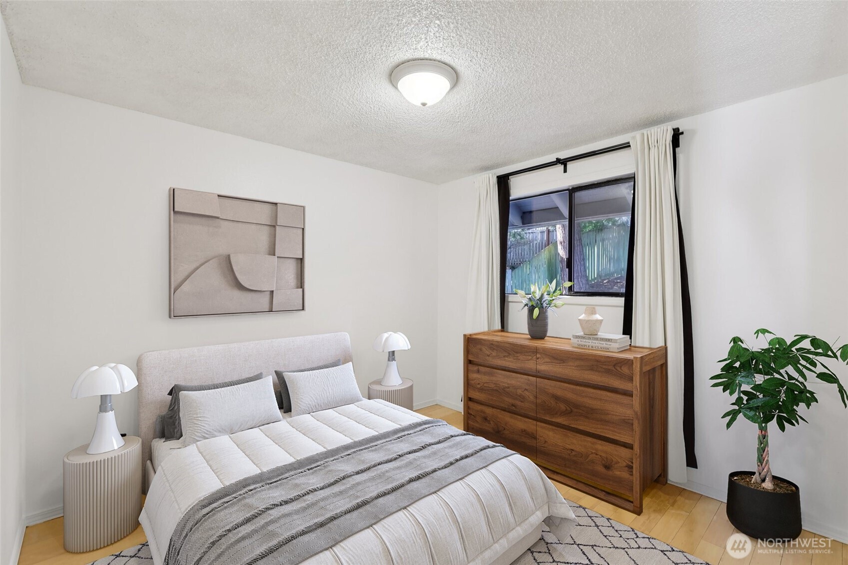 32229 2nd Avenue Southwest Federal Way, WA 98023 - Photo 15 of 40 a bedroom with a bed and a potted plant
