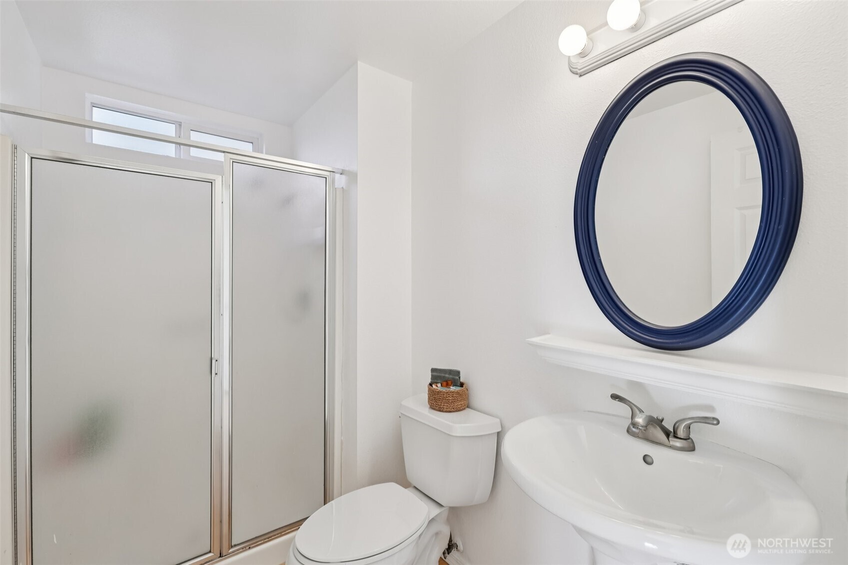 32229 2nd Avenue Southwest Federal Way, WA 98023 - Photo 17 of 40 a bathroom with a sink a toilet and a mirror