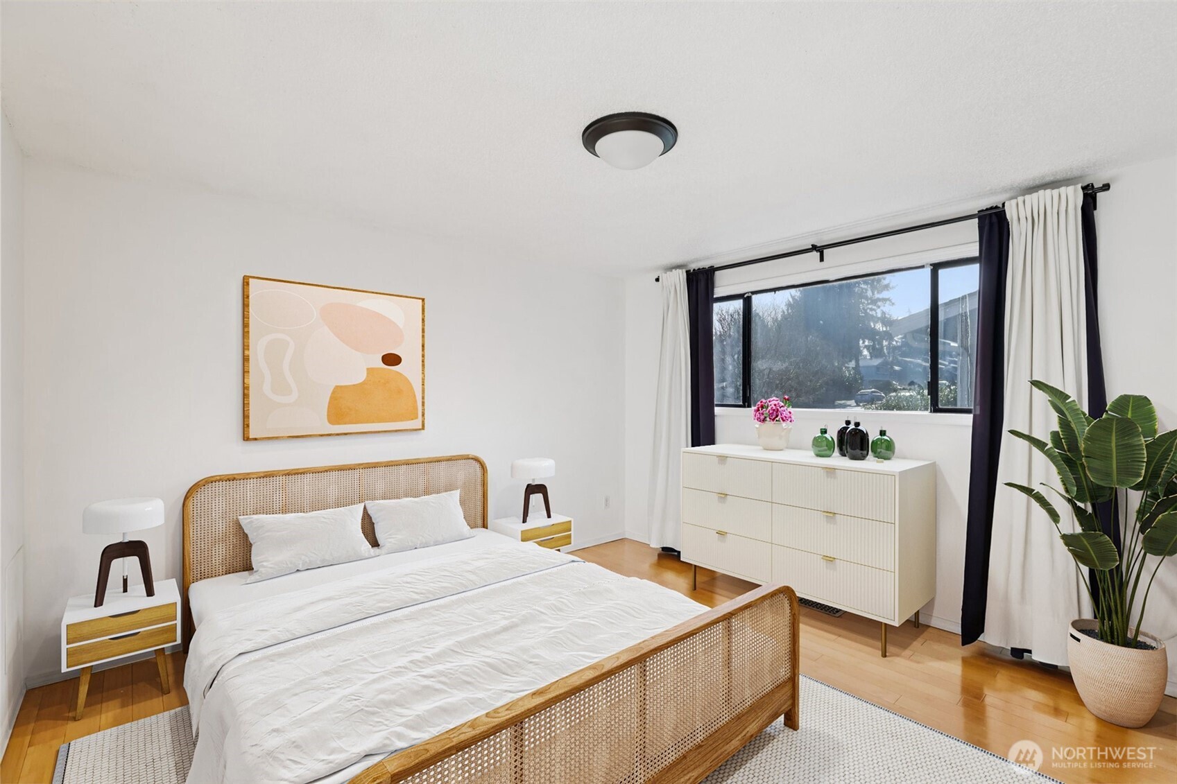 32229 2nd Avenue Southwest Federal Way, WA 98023 - Photo 18 of 40 a bedroom with a bed and a potted plant on the dresser