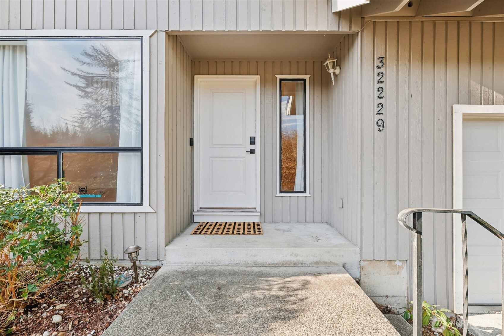 32229 2nd Avenue Southwest Federal Way, WA 98023 - Photo 2 of 40 a view of a wooden door with a house