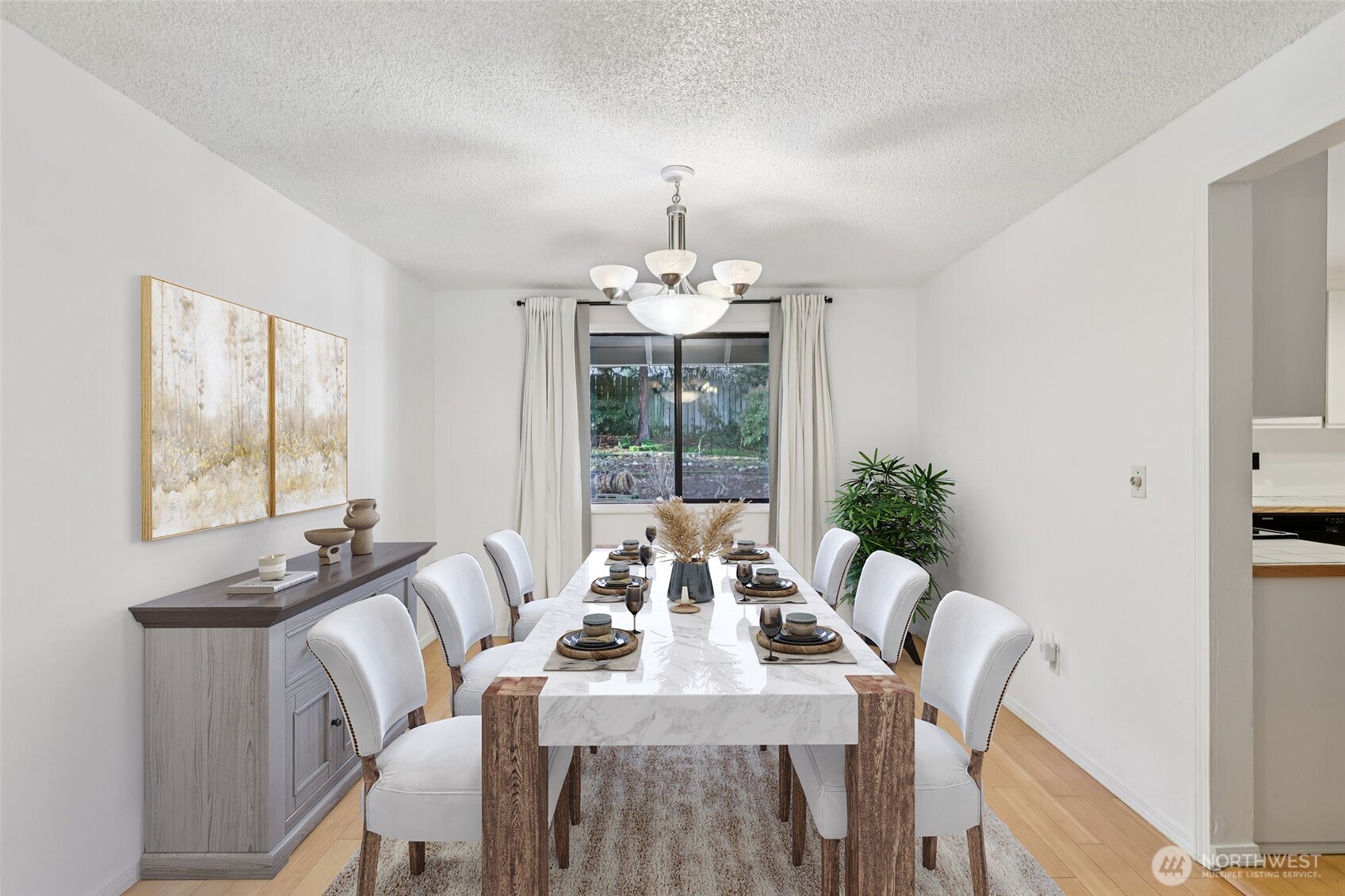 32229 2nd Avenue Southwest Federal Way, WA 98023 - Photo 7 of 40 a view of a dining room with furniture wooden floor and chandelier