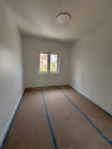 a view of an empty room and window