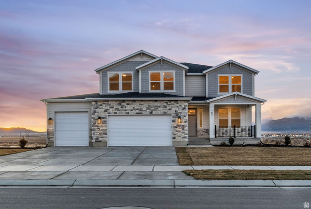 2821 Scarlet Road, Unit 149 Eagle Mountain, UT 84005 - Photo 27 of 28 Our two-story "Magnolia" with large covered porch and beautiful mountain views including front yard landscapce.