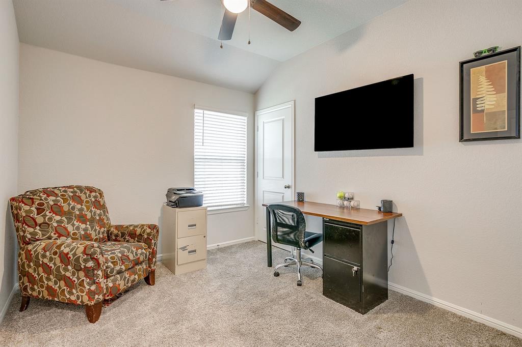 2313 Stallings Road Fort Worth, TX 76108 - Photo 23 of 30 a living room with furniture and a flat screen tv