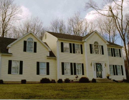 2 Gardan Road New Milford, CT 06776 - Photo 1 of 1 a front view of a house with a yard