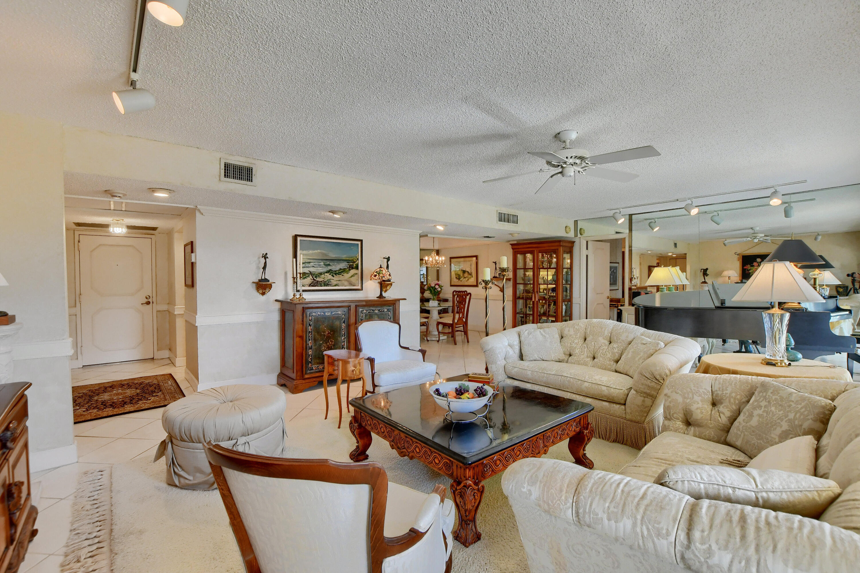 951 De Soto Road, Unit 330 Boca Raton, FL 33432 - Photo 5 of 44 a living room with furniture and wooden floor