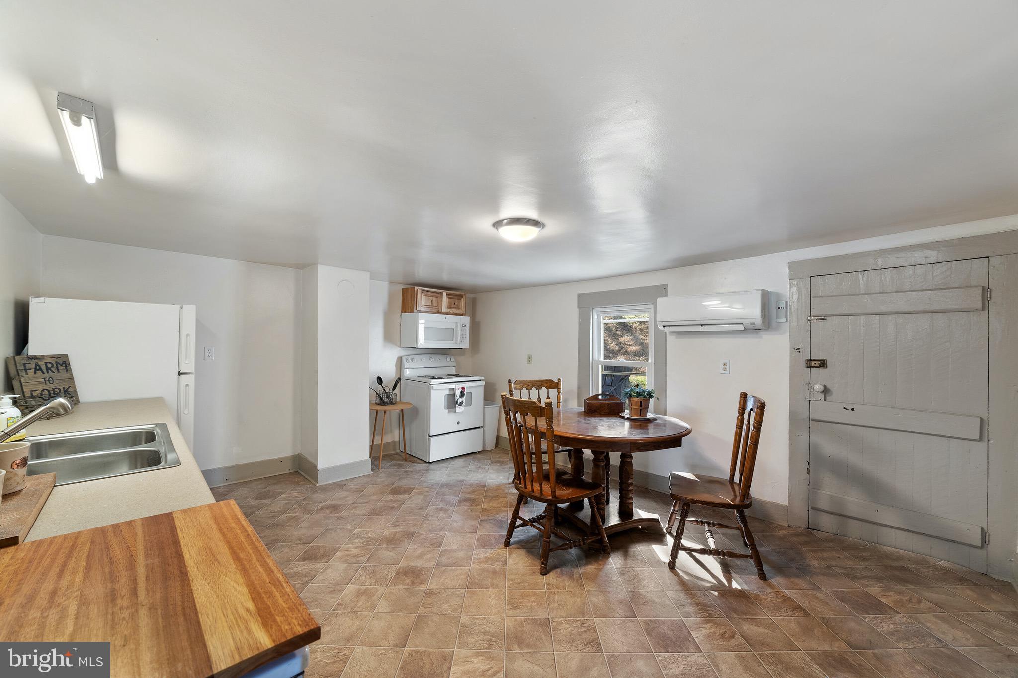 418 Round Hill Road Boston, VA 22713 - Photo 4 of 22 Kitchen with door to outdoor grilling patio