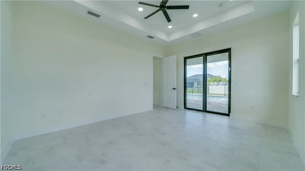 a view of a hallway with wooden floors