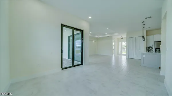 a view of a room with a ceiling fan