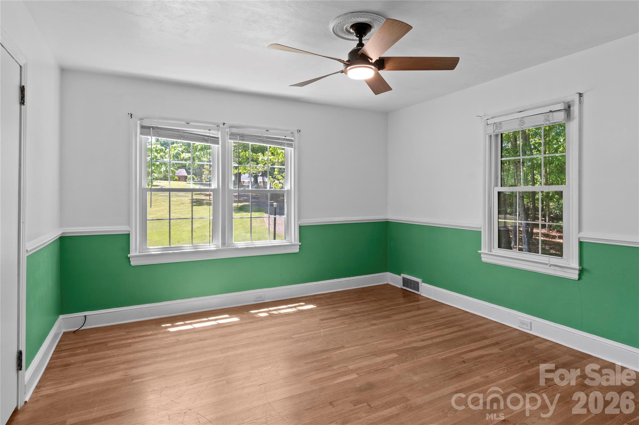 951 Dodson Mill Road Pilot Mountain, NC 27041 - Photo 25 of 48 a view of an empty room with wooden floor and a window