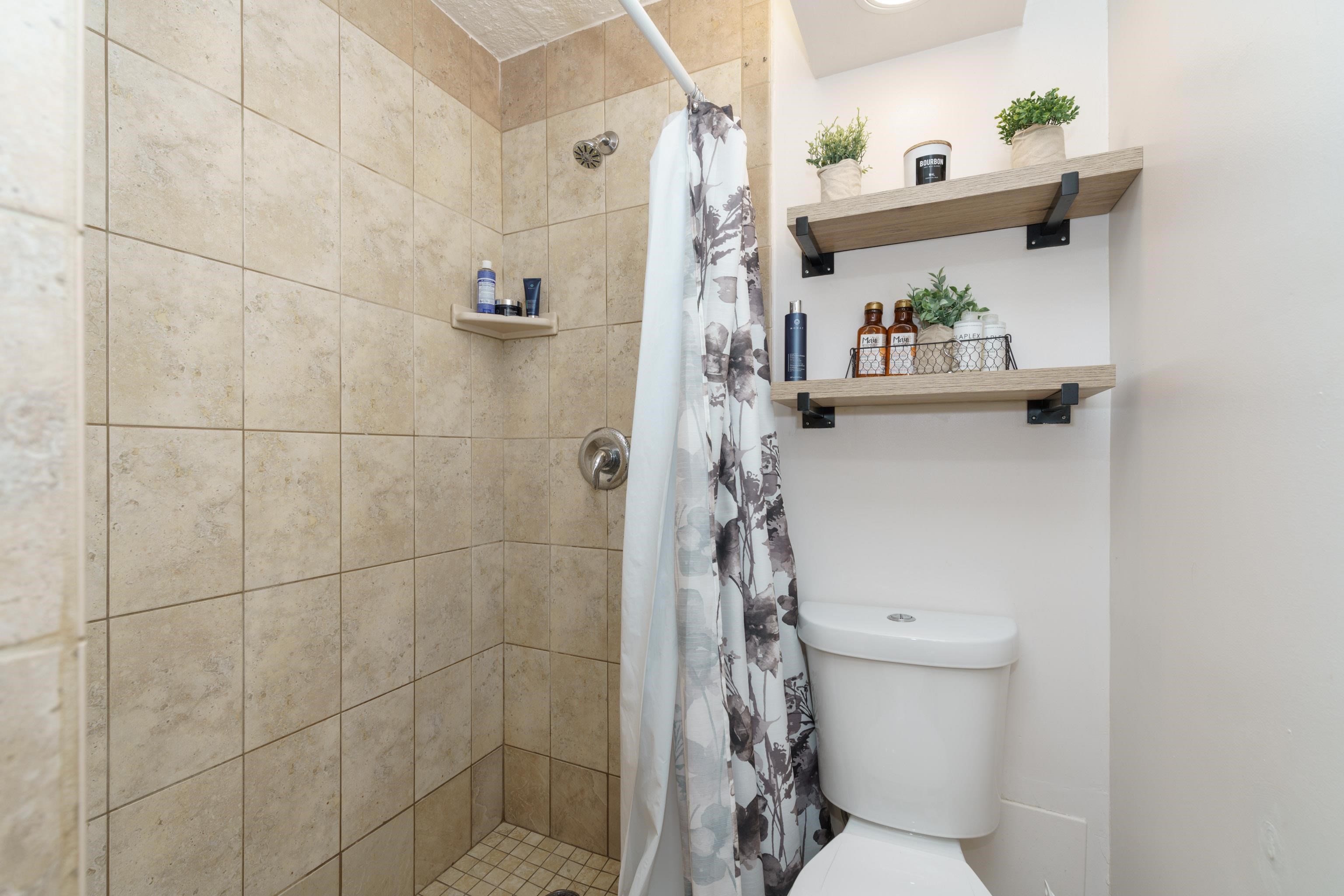 3660 Lower Honoapiilani Road, Unit 111 Lahaina, HI 96761 - Photo 13 of 28 a bathroom with a toilet and a shower