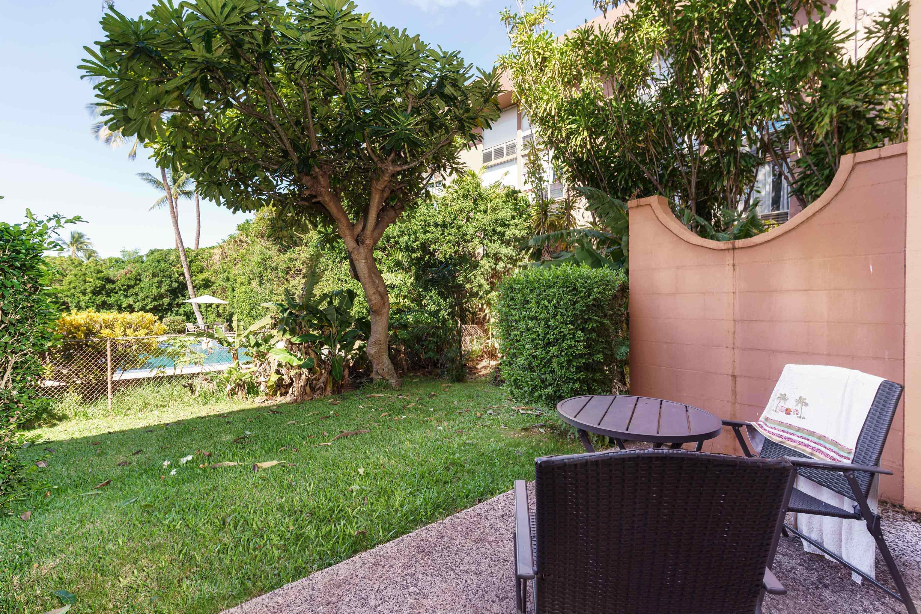 3660 Lower Honoapiilani Road, Unit 111 Lahaina, HI 96761 - Photo 18 of 28 a view of a chair and table in the garden