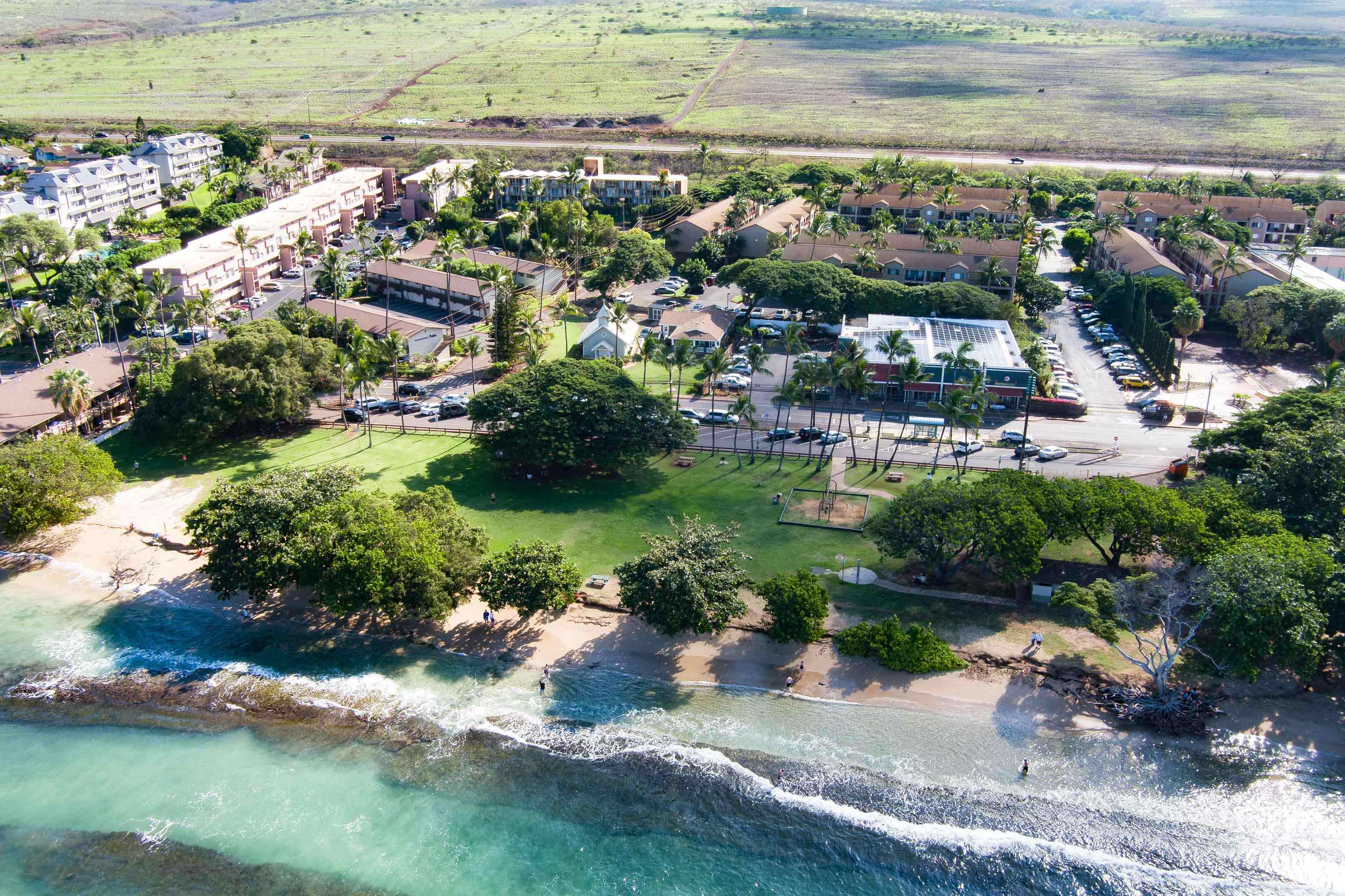 3660 Lower Honoapiilani Road, Unit 111 Lahaina, HI 96761 - Photo 22 of 28 an aerial view of residential houses with outdoor space and trees