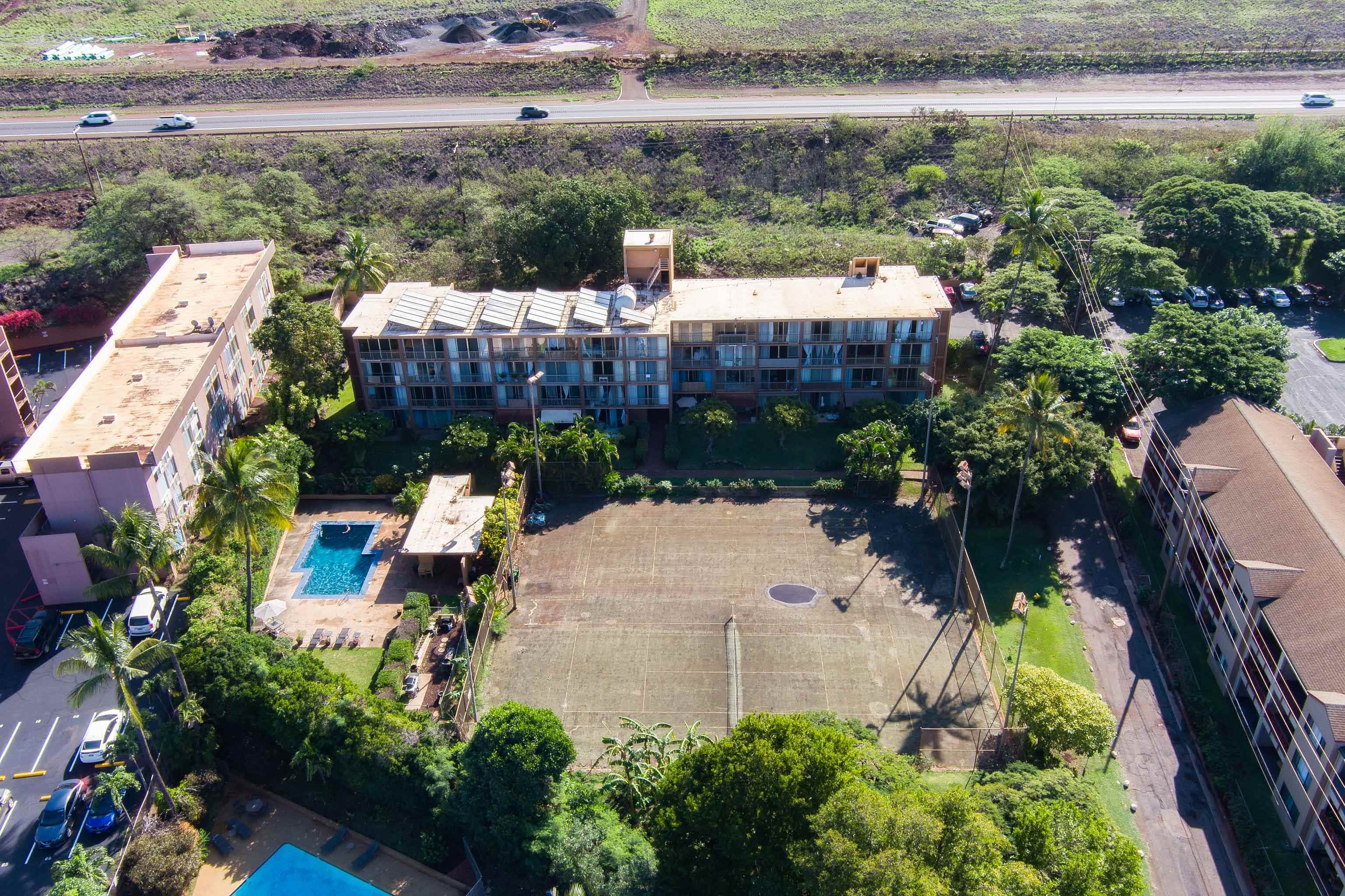 3660 Lower Honoapiilani Road, Unit 111 Lahaina, HI 96761 - Photo 26 of 28 an aerial view of a house with a garden