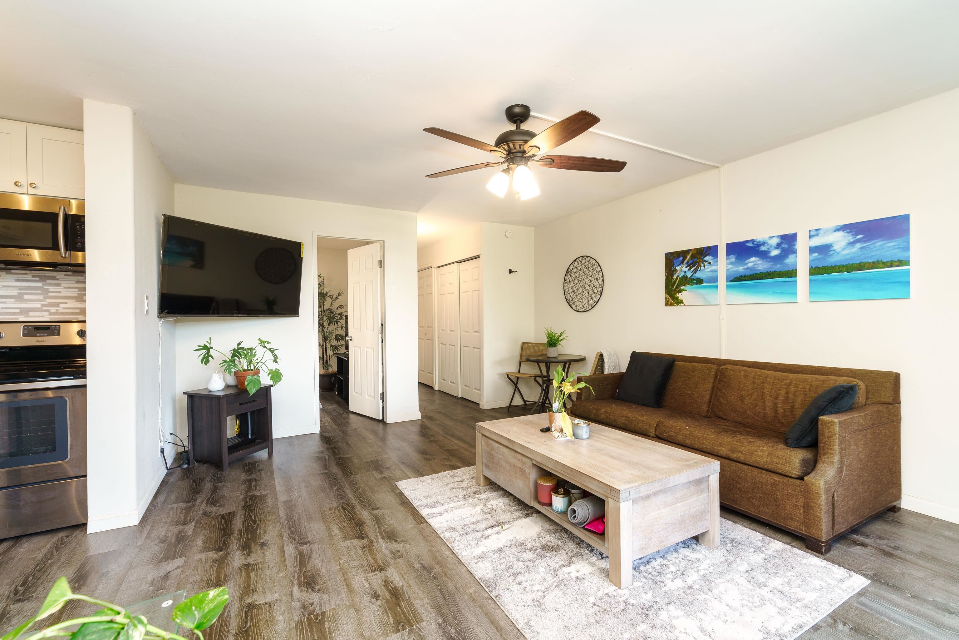 3660 Lower Honoapiilani Road, Unit 111 Lahaina, HI 96761 - Photo 5 of 28 a living room with furniture and a flat screen tv