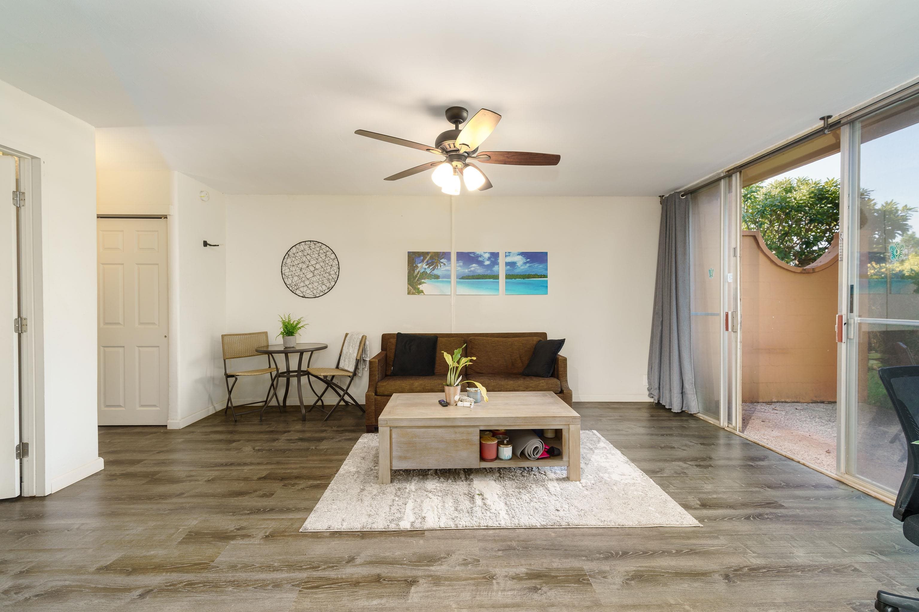3660 Lower Honoapiilani Road, Unit 111 Lahaina, HI 96761 - Photo 8 of 28 a living room with furniture and a window