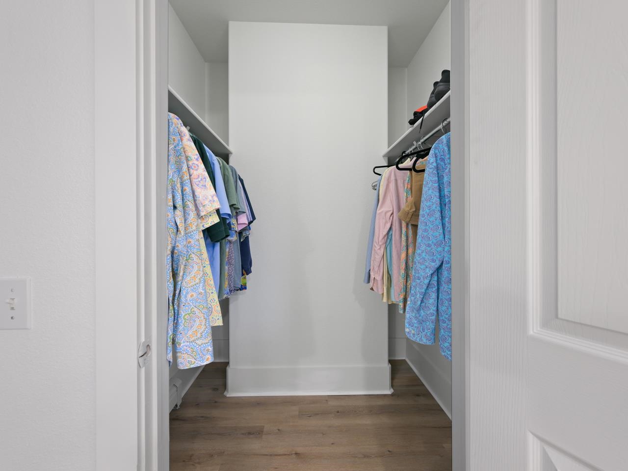1117 Buttercup Lane Fruita, CO 81521 - Photo 19 of 25 a view of a hallway with wooden floor and entryway