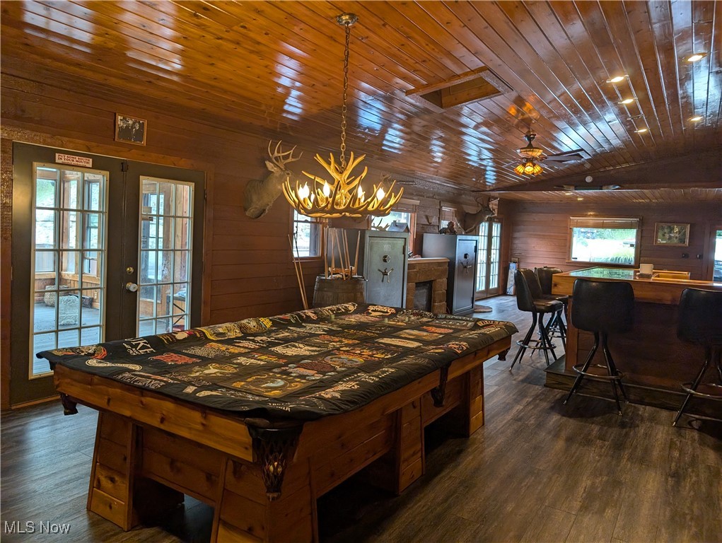 46136 Carlisle Road Lisbon, OH 44432 - Photo 30 of 48 Game room with dark wood-type flooring, wooden walls, and wooden ceiling