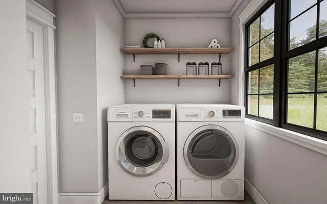 a view of livingroom with washer and dryer