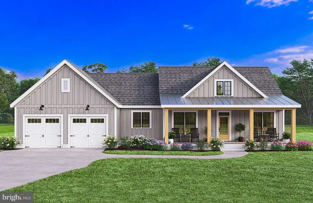 a front view of a house with a yard patio and fire pit