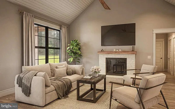 a living room with furniture a flat screen tv and a fireplace