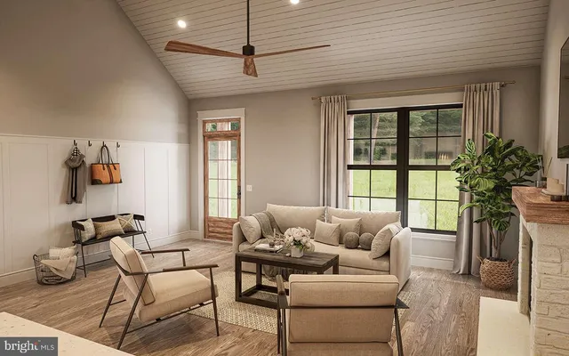 a living room with furniture and a large window