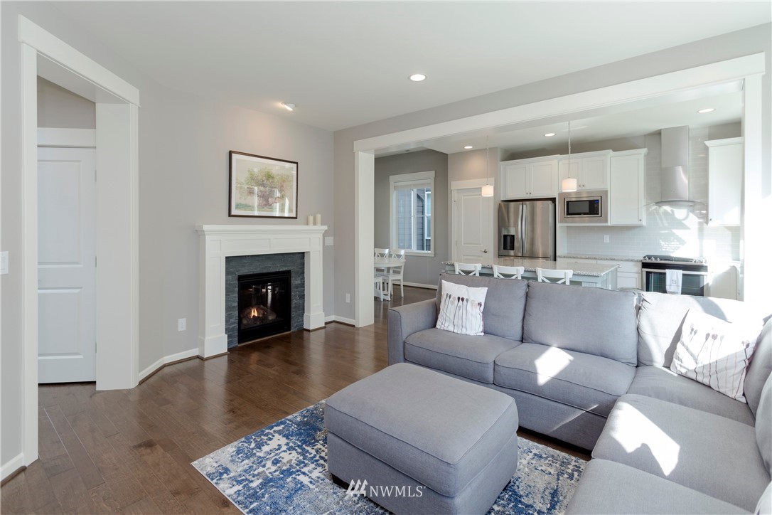 762 Lyons Avenue Northeast Renton, WA 98059 - Photo 11 of 33 a living room with furniture and a fireplace