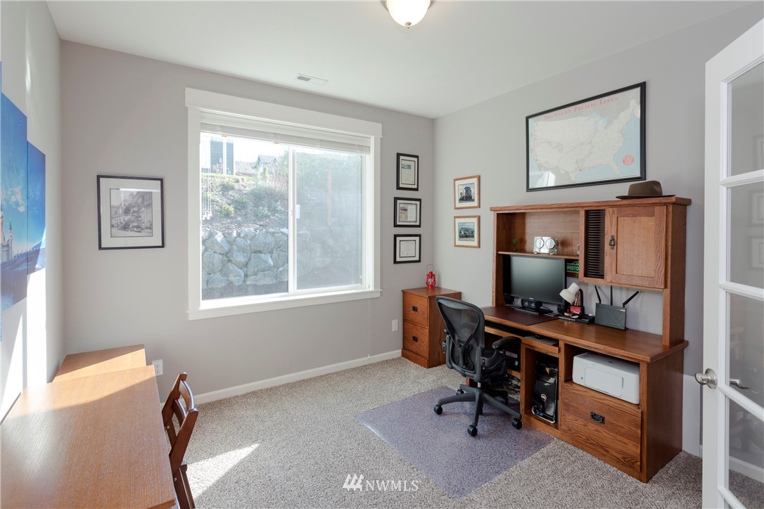 762 Lyons Avenue Northeast Renton, WA 98059 - Photo 12 of 33 a view of a workspace with furniture and a window