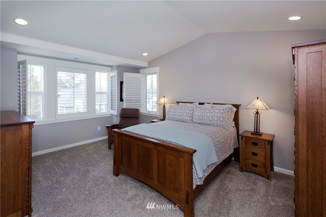 762 Lyons Avenue Northeast Renton, WA 98059 - Photo 19 of 33 a bedroom with a bed and a window