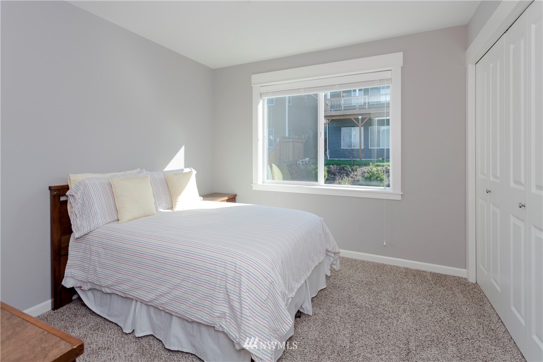 762 Lyons Avenue Northeast Renton, WA 98059 - Photo 24 of 33 a bedroom with a bed and a window