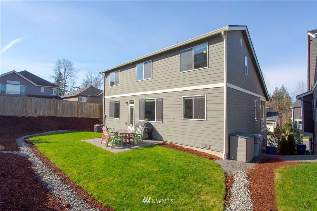 762 Lyons Avenue Northeast Renton, WA 98059 - Photo 28 of 33 a front view of house with a garden and patio