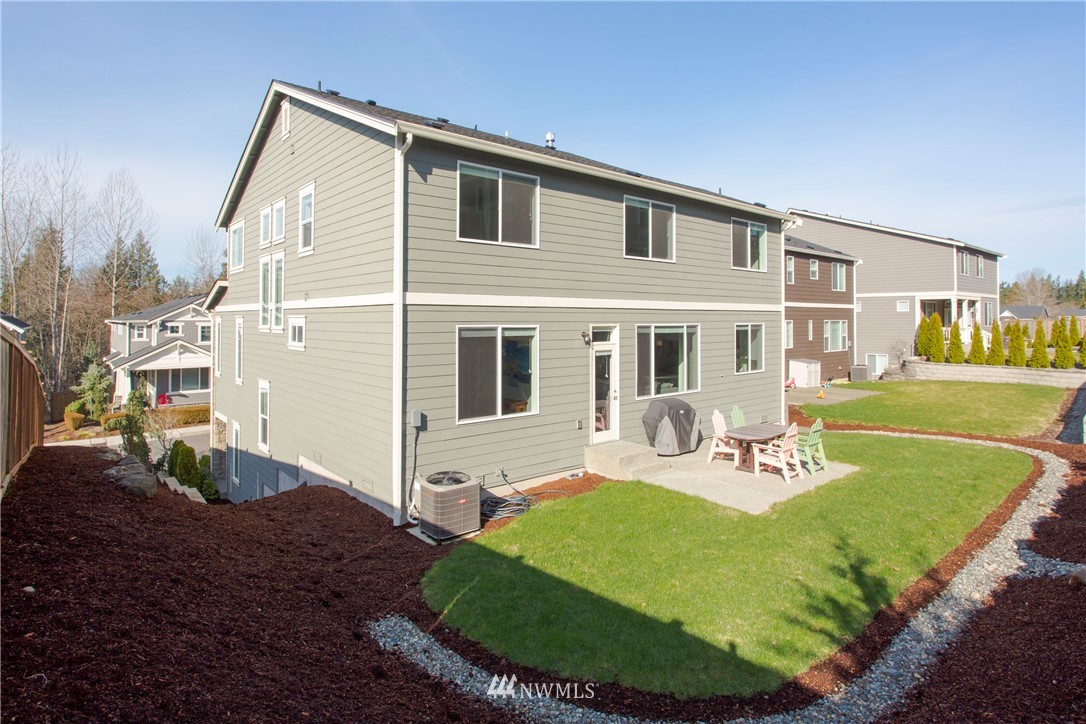 762 Lyons Avenue Northeast Renton, WA 98059 - Photo 29 of 33 a view of a house with backyard and sitting area