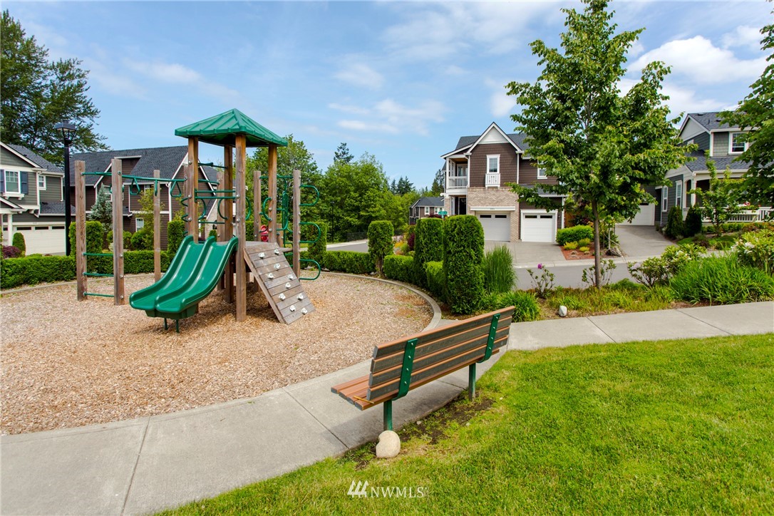 762 Lyons Avenue Northeast Renton, WA 98059 - Photo 31 of 33 a view of a house with backyard and a tree